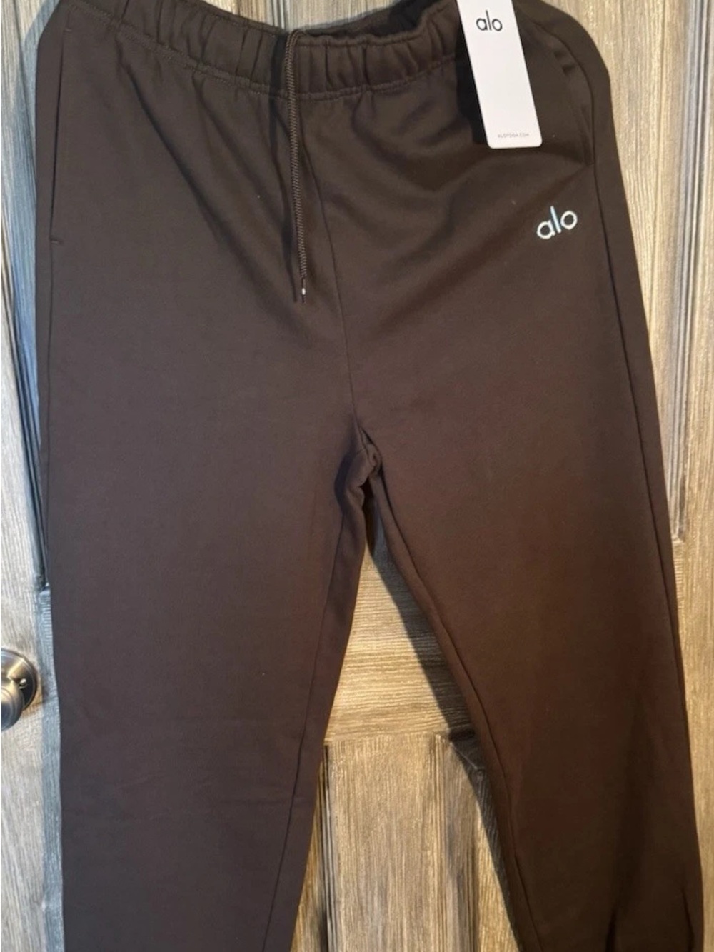ALO Men’s Acolade sweatpants  in Brown with Subtle Logo and drawstring waist.